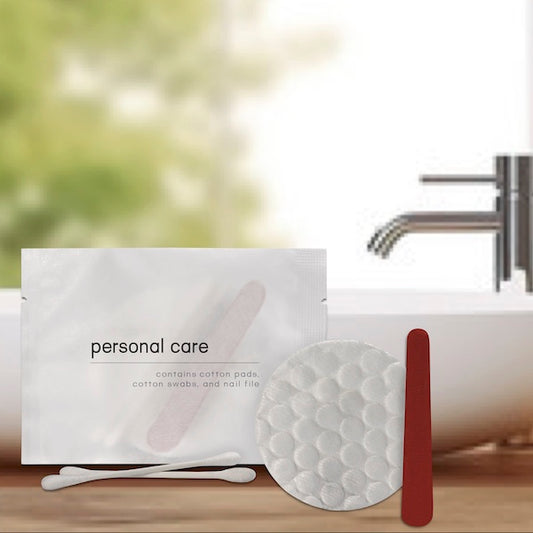 Individually wrapped personal care items including cotton pads, swabs, and a nail file | GuestOutfitters.com